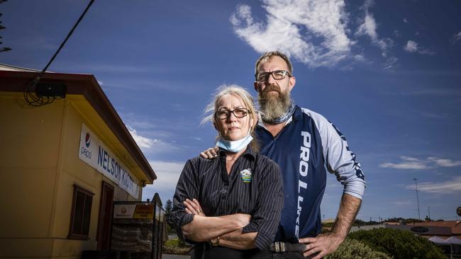 Nelson Kiosk and Post Office operators Andrea Winfield and Paul Singleton live on the SA side of the border, and work on the Victorian side. Picture: Nicole Cleary