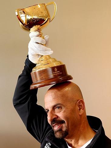 Marwan Koukash wears the Melbourne Cup as a hat, as you do.