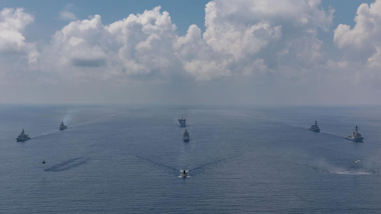 HMAS Ballarat (far left) sails with warships and a submarine from India, Japan and the United States during Exercise Malabar 2020. Picture: Australian Defence Force.