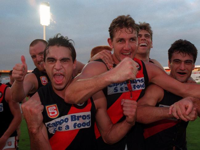 Darryl Thomas (front left) celebrating a West Adelaide win in 1995.