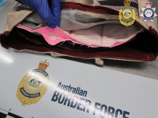 Thai national charged over 8kg heroin import at Melbourne Airport.