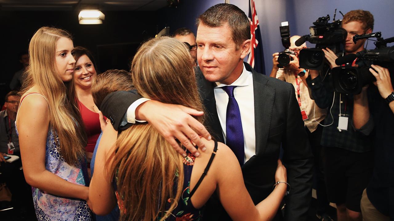 Mike Baird supported by his family after resigning from the top job and from politics. Family was one of the reasons Baird gave for his shock resignation. Picture: Dylan Robinson