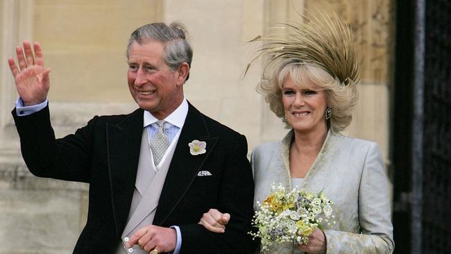 Prince Charles waves with the Duchess of Cornwall, formerly Camilla Parker Bowles as they exit St George's Chapel in Windsor, England, following the church blessing of their civil wedding ceremony in April, 2005. Picture: Alastair Grant/Pool/AFP