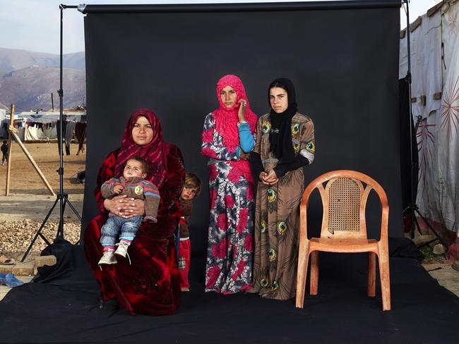“Lost Family Portraits” by photographer Dario Mitidieri which won third prize in the People singles category shows a portrait of a Syrian refugee family in a camp in Bekaa Valley, Lebanon, on Dec. 15, 2015. The empty chair in the photograph represents a family member who has either died in the war or whose whereabouts are unknown. (Dario Mitidieri, World Press Photo via AP)