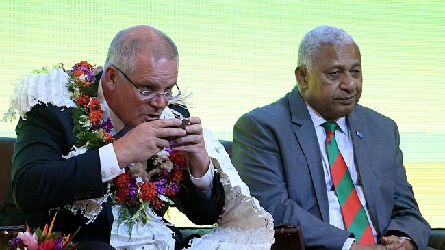 Scott Morrison, with Fijian PM Frank Bainimarama, was OK during his recent trip to Fiji but some of his staff weren’t so lucky. Picture: AAP.