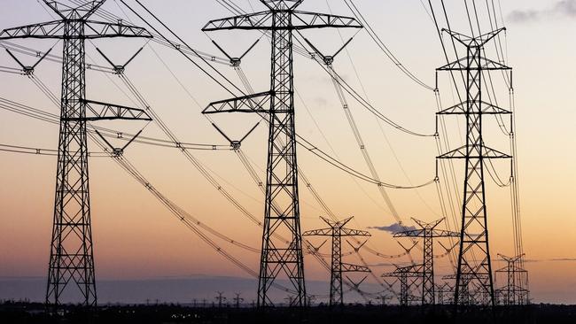 Electricity pylons during dusk evening sky sunset. Energy generic