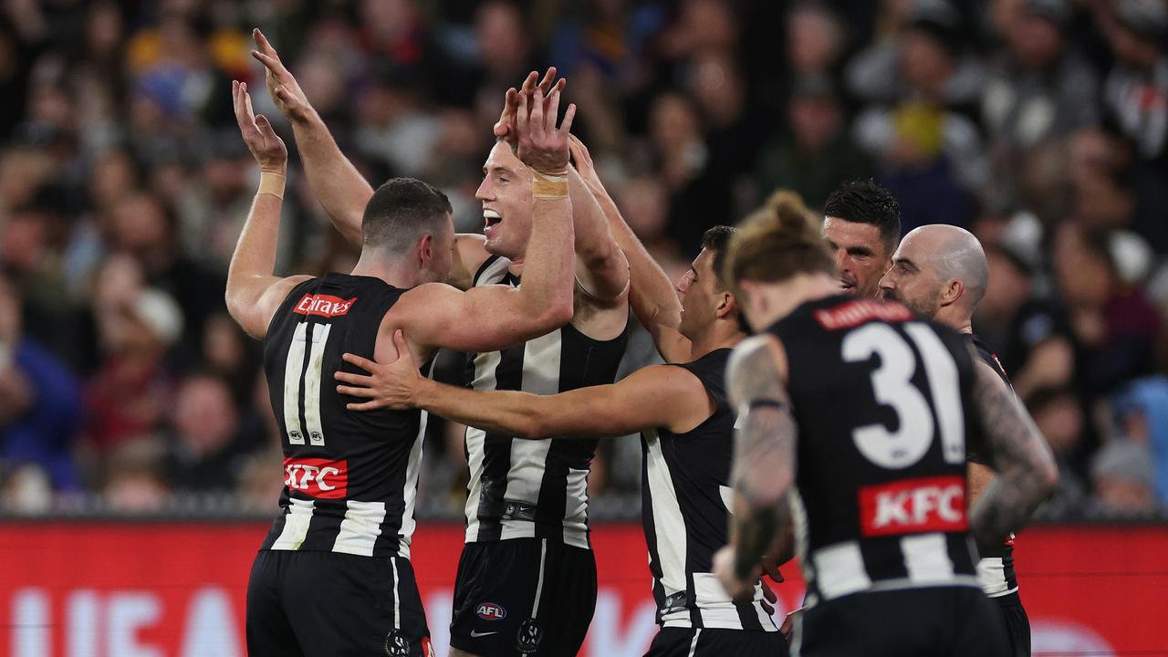 MELBOURNE, AUSTRALIA – AUGUST 17: Darcy Cameron of the Magpies celebrates kicking a goal during the round 23 AFL match between Collingwood Magpies and Brisbane Lions at Melbourne Cricket Ground, on August 17, 2024, in Melbourne, Australia. (Photo by Daniel Pockett/Getty Images)