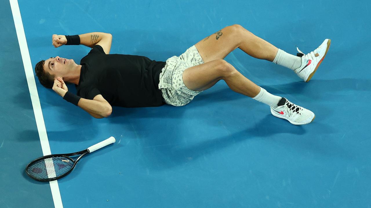 MELBOURNE, AUSTRALIA - JANUARY 29: Thanasi Kokkinakis of Australia celebrates a point in his Men's Doubles Final match with Nick Kyrgios of Australia against Matthew Ebden of Australia and Max Purcell of Australia during day 13 of the 2022 Australian Open at Melbourne Park on January 29, 2022 in Melbourne, Australia. (Photo by Clive Brunskill/Getty Images)