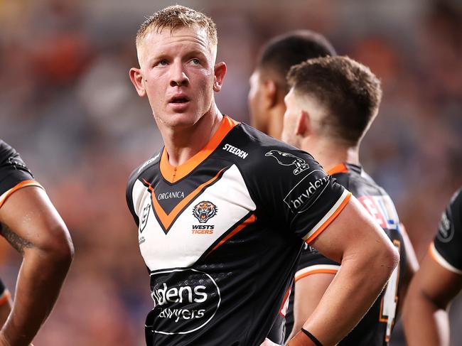 SYDNEY, AUSTRALIA - MARCH 12:  Alex Seyfarth  of the Tigers looks dejected after a try during the round one NRL match between the Wests Tigers and the Melbourne Storm at CommBank Stadium, on March 12, 2022, in Sydney, Australia. (Photo by Mark Kolbe/Getty Images)