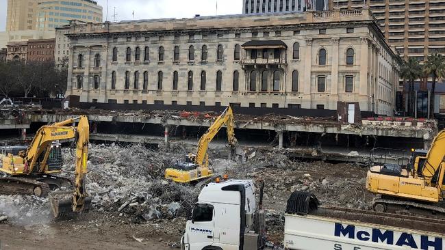 Tearing down the House — well, not quite. Demolition work at Festival Plaza.