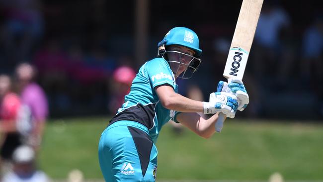 Beth Mooney hits a boundary at North Sydney Oval.