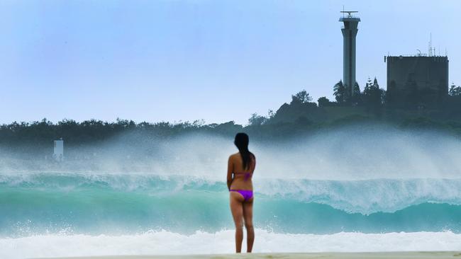 A beachgoer takes in the conditions at Mooloolaba. PIC: Lachie Millard