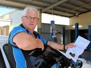 RIDICULOUS: B&K Motors owner Dave Kemp pays registration on about 12 different vehicles. With fees increasing every year, it's a strain on his local business. Picture: Marian Faa