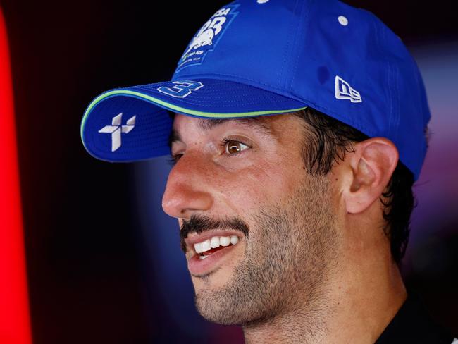 SPIELBERG, AUSTRIA - JUNE 30: 9th placed Daniel Ricciardo of Australia and Visa Cash App RB talks to the media in the Paddock after the F1 Grand Prix of Austria at Red Bull Ring on June 30, 2024 in Spielberg, Austria. (Photo by Chris Graythen/Getty Images)