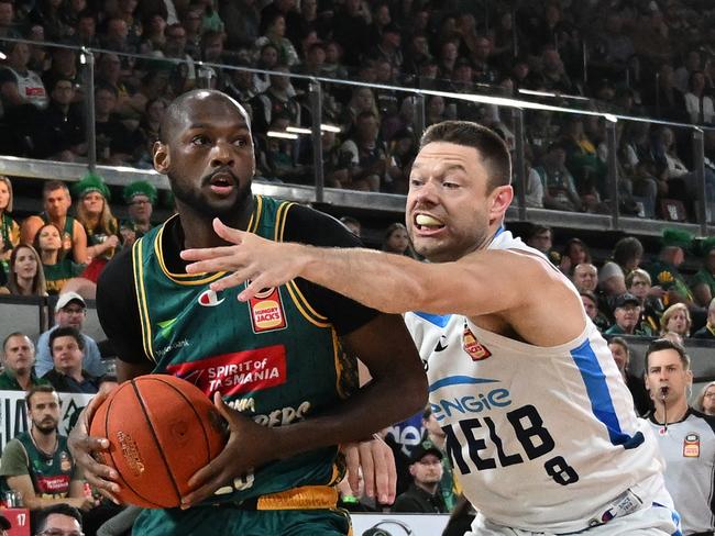 Tasmania’s Milton Doyle under pressure from Melbourne United’s Matthew Dellavedova. Picture: Getty Images