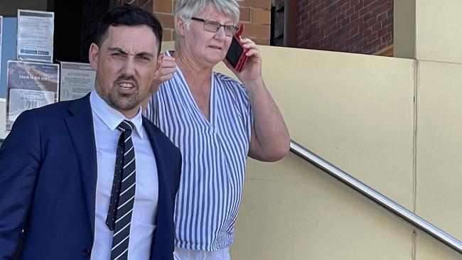 Elizabeth Anne Turner (right) leaves Mackay courthouse with her solicitor after a pre-trial hearing in the district court.