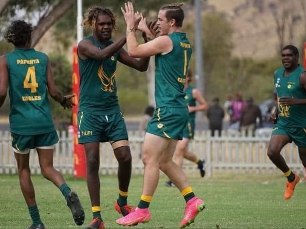 Papunya player Braydon Wiley (centre) is concerned scores of community footballers will have “nothing to look forward to” in 2023. Picture: Braydon Wiley.