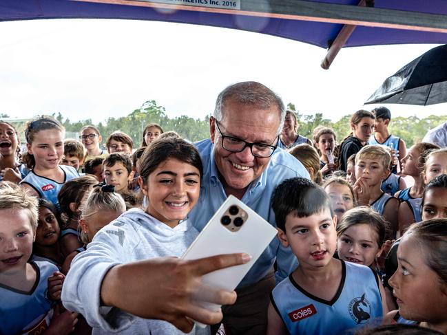 The PM took selfies with some of the kids at Sylvania Waters Athletics Track in Sydney. Picture: NCA NewsWire/Flavio Brancaleone