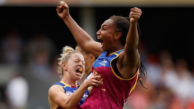 Kate McCarthy (left) and Sabrina Frederick-Traub of the Lions (right) celebrate a goal during the 2017 AFLW Grand Final match against the Adelaide Crows on the Gold Coast. Photo: Michael Willson/AFL Media/Getty Images