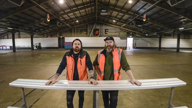 Beer and Barbecue Festival organiser Gareth Lewis, right, and Aaron Sandow after packing up the hall on Tuesday. Picture: Roy Van Der Vegt