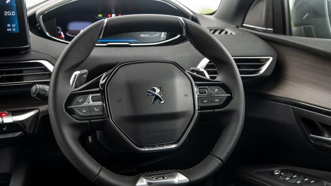 Peugeot adopts a unique driving position with a small sports steering wheel.