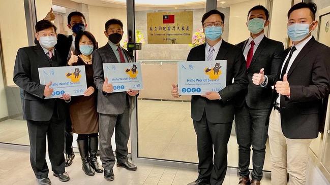 The director of The Taiwanese Representative Office in Lithuania, Eric Huang, third from right, with staff members Vilnius. Picture: AFP