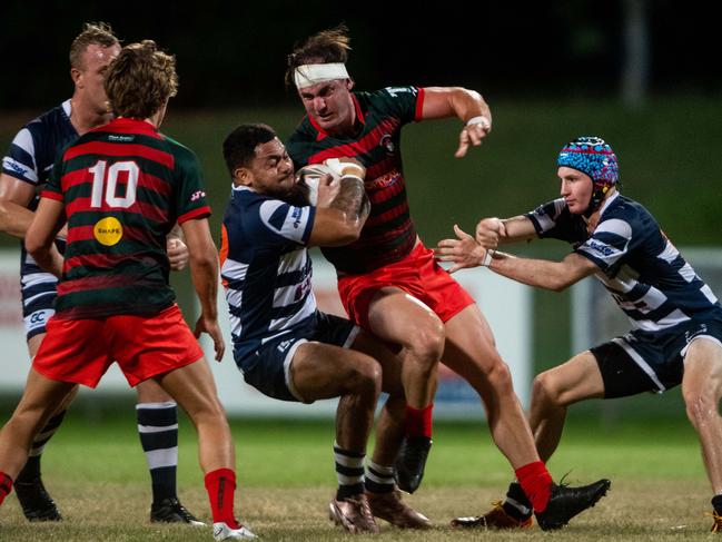 Action from Darwin A-grade Rugby Union Round 4: Casuarina Cougars v South Darwin Rabbitohs at Rugby Park, Marrara. Left Centre Timothy Anderson is brought down by Simaika Salaa.Picture: Che Chorley