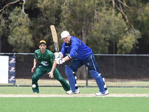 Mt Waverley playing coach Michael Sheedy flicks a ball through the on side during his hundred against Croydon.