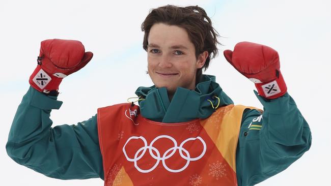 Scotty James celebrates his bronze medal in the snowboard halfpipe. Picture: Getty