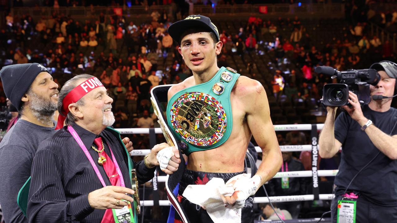 Sebastian Fundora poses his title belts after defeating Tim Tszyu at T-Mobile Arena on March 30, 2024.