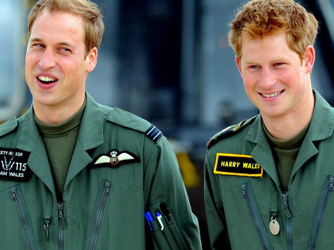 Princes William (L) and Harry stand during a photocall at Royal Air Force Shawbury near Shrewsbury, central England. Picture: Paul Ellis / AFP.