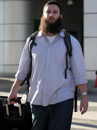 The radical Islamic preacher Musa Cerantonio arrives at Melbourne Airport after being deported from the Philippines.