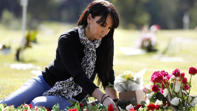 Tanya Petrus at the graveside memorial for Merna at Kemps Creek Cemetery. Picture: Jonathan Ng