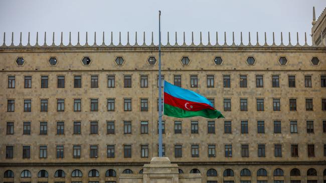 Azerbaijan's national flag at half-mast in the memory of the crash victims. Picture: Aziz Karimov/Getty Images