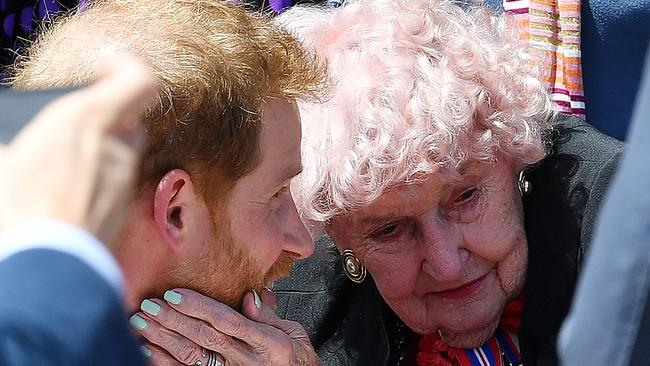 Daphne Dunn affectionately touches Prince Harry’s face. Picture: Saaed Khan/AFP