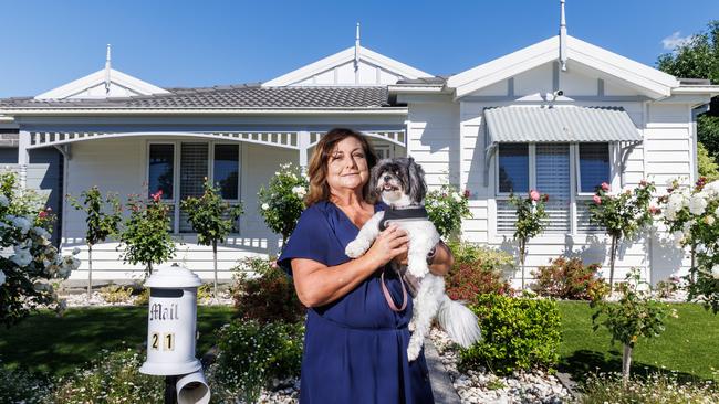 Sue Tantaro with pet dog Teddy at her home on Parkleigh Drive, Kurunjang, which is for sale. Picture: Aaron Francis.