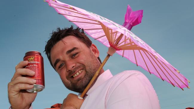 Gavin McCoy from Geelong enjoys a beer on the lawn.