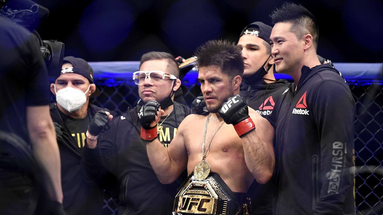 Henry Cejudo celebrates defeating Dominick Cruz