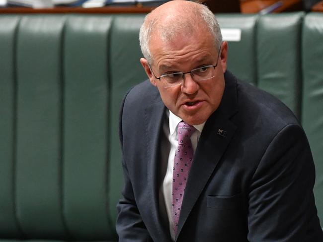 CANBERRA, AUSTRALIA - MARCH 15: Prime Minister Scott Morrison reacts during Question Time in the House of Representatives at Parliament House on March 15, 2021 in Canberra, Australia. Thousands are expected at Ã¢â¬ÅMarch 4 JusticeÃ¢â¬Â rallies across Australia, calling for action against gendered violence in Parliament, as news of the alleged rape of former Brittany Higgins at Parliament House and allegations that Attorney-General Christian Porter raped a 16-year-old gear when he was 17 in 1988 continue to cause outrage. (Photo by Sam Mooy/Getty Images)