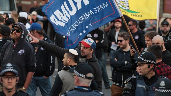 Far-Right activists Avi Yemini and Neil Erikson look on during the protest. Picture: AAP Image/Stefan Postles