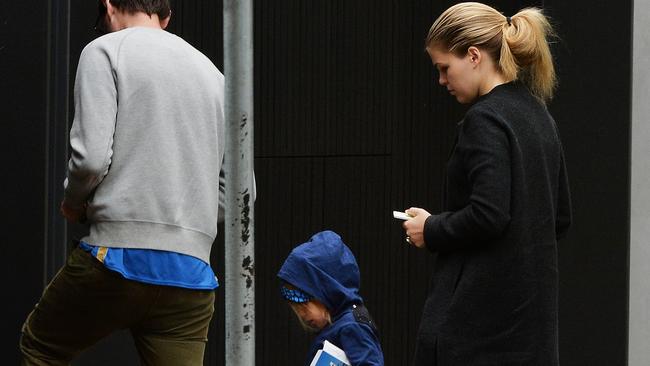 Belle Gibson and partner Clive Rothwell and son Oliver outside their house in Elwood. Picture:Rob Leeson