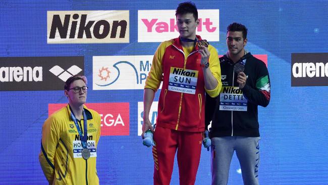 (FILES) In this file photo taken on July 21, 2019 silver medallist Australia's Mack Horton (L) refuses to stand on the podium with gold medallist China's Sun Yang (C) and bronze medallist Italy's Gabriele Detti after the final of the men's 400m freestyle event during the swimming competition at the 2019 World Championships at Nambu University Municipal Aquatics Center in Gwangju. - Horton says he would have carried out his controversial podium protest against China's Sun Yang even if he had known fellow Australian swimmer Shayna Jack failed a drugs test. (Photo by Ed JONES / AFP)