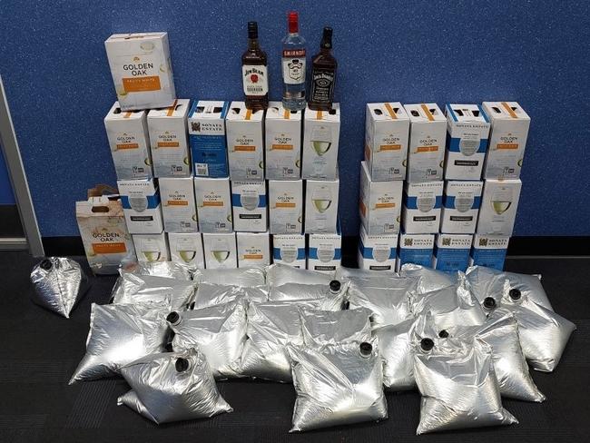 Woman charged after 200 litres of alcohol seized from home