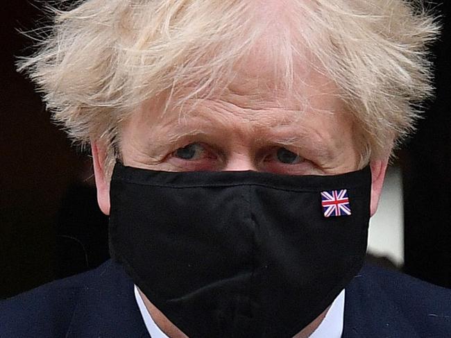 Britain's Prime Minister Boris Johnson, wearing a face mask to combat the spread of the novel coronavirus, leaves 10 Downing Street in central London on May 12, 2021, before heading to the House of Commons. (Photo by JUSTIN TALLIS / AFP)