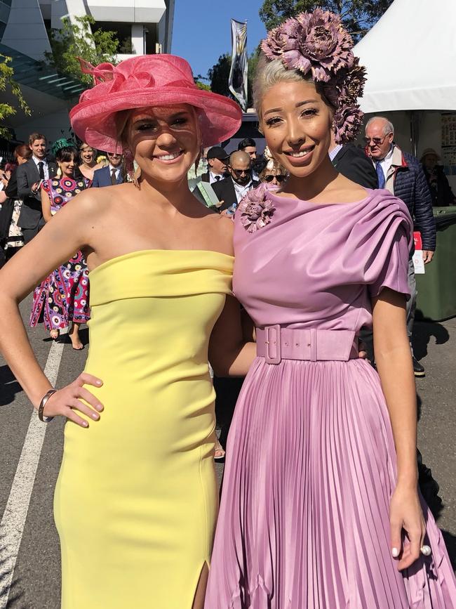 Amy Gyss, 26, and Milano Imai, 31, at Flemington Racecourse station. Picture: Remy Varga