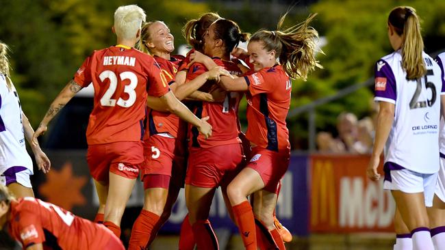 Adelaide United players celebrate Veronica Latsko’s second goal against Perth on Thursday night. Picture: AAP