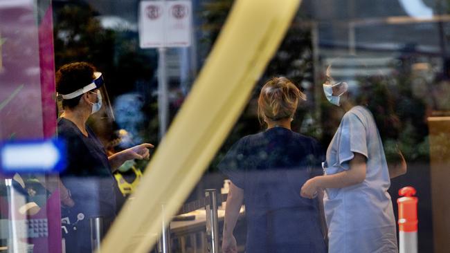 Medical staff in the foyer of the Novotel Hotel in South Wharf on Sunday morning. Picture: NCA NewsWire / David Geraghty