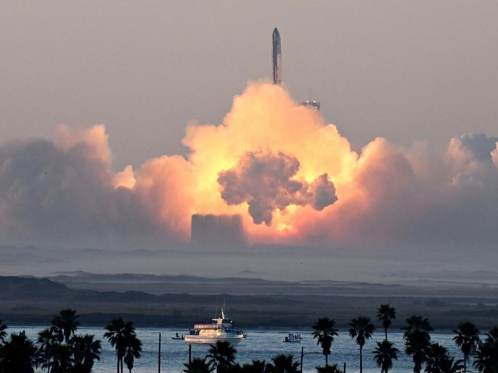 TOPSHOT - SpaceX's Starship rocket launches from Starbase during its second test flight in Boca Chica, Texas, on November 18, 2023. SpaceX on November 18, 2023, carried out the second test launch of Starship, the largest rocket ever built that Elon Musk hopes will one day colonize Mars, while NASA awaits a modified version to land humans on the Moon. It comes after a first attempt to fly the spaceship in its fully-stacked configuration back in April ended in a spectacular explosion over the Gulf of Mexico. (Photo by TIMOTHY A. CLARY / AFP)