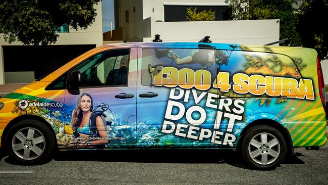 Signage on the Adelaide Scuba Dive vehicle. Ms Whyte said “divers do it deeper” was a comman slogan in the industry. Picture: Mike Burton