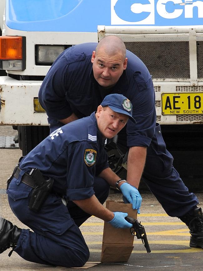 Police gather evidence after an armoured Chubb Security van was ambushed in Lane Cove in 2009.